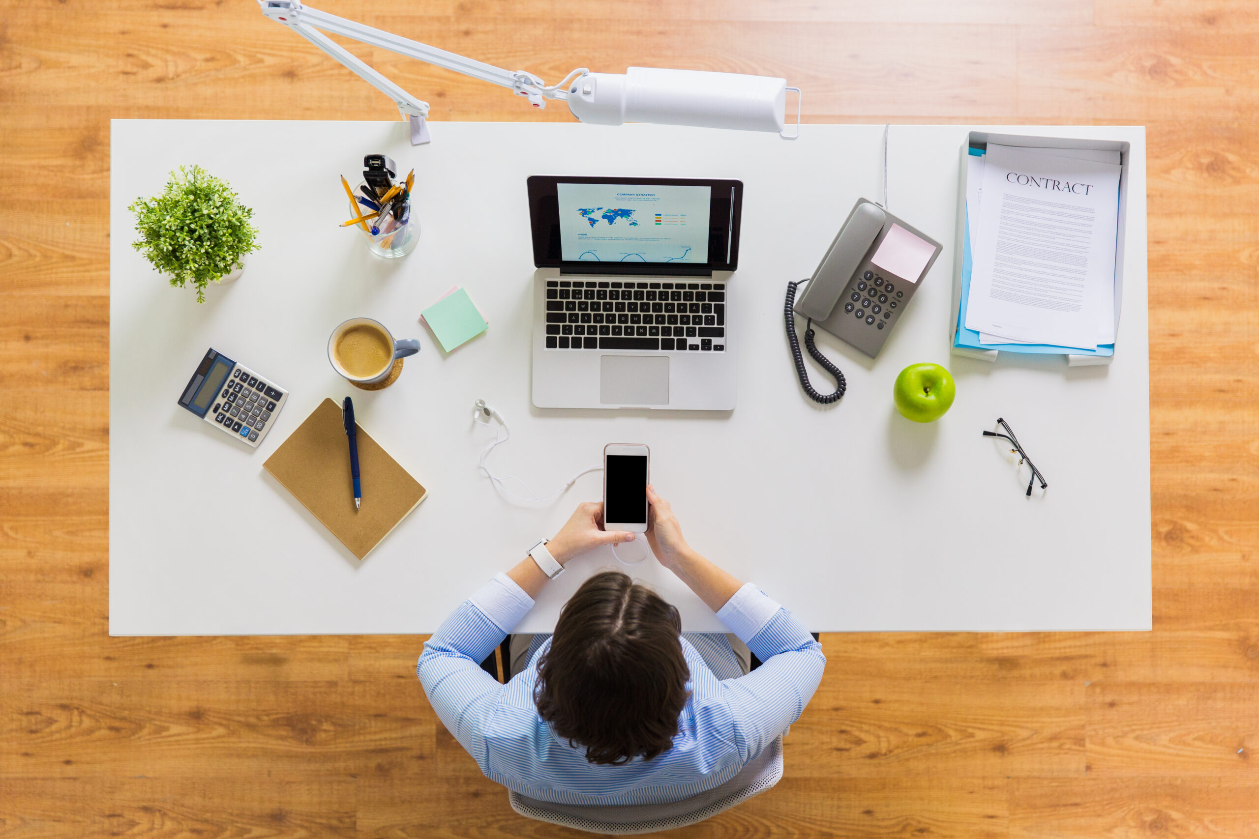 businesswoman with laptop and smartphone at office