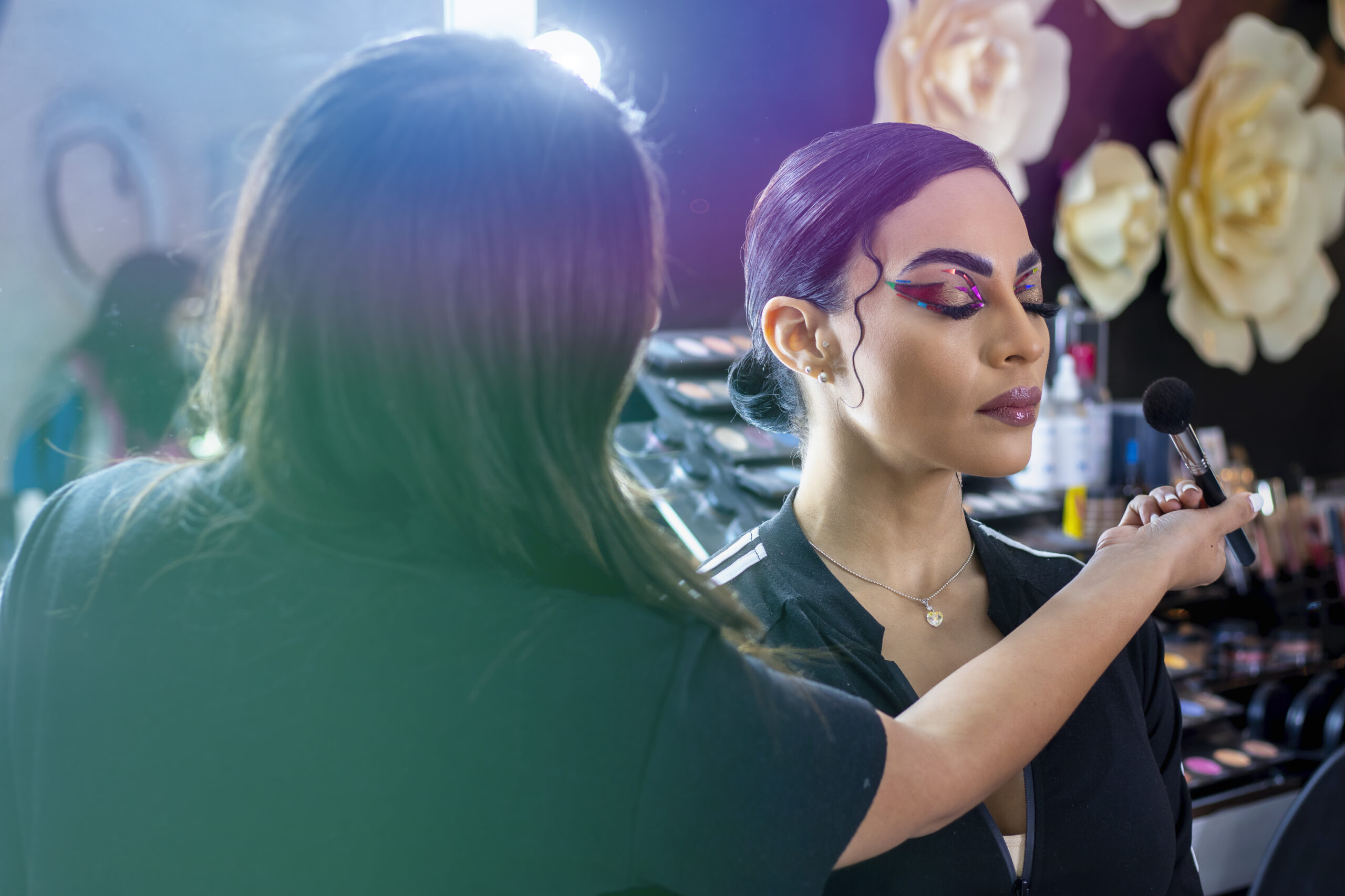 Professional makeup artist doing a celebrity makeup